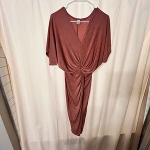 Beautiful rust/clay colored body sculpting dress. Size XS.